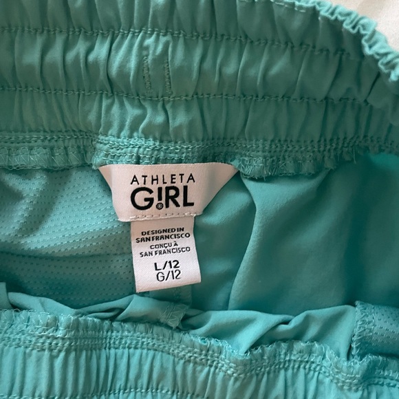 Athleta teal girl shorts with side pockets - Picture 2 of 3